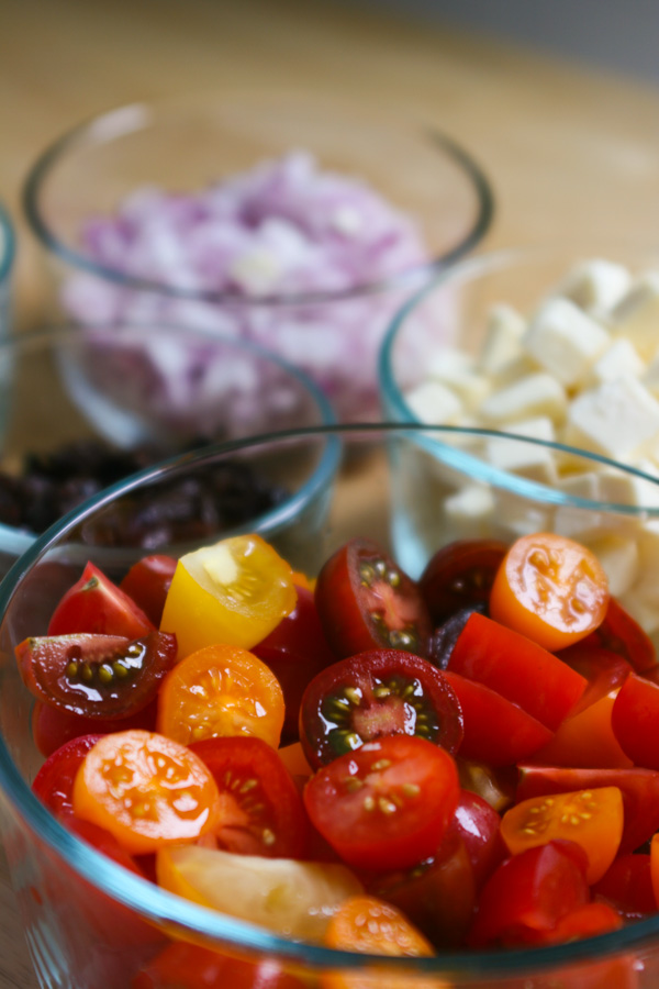 quick, easy summer pasta salad loaded with sweet cherry tomatoes, tangy feta, red onion, and savory olives. great for picnics and BBQs!