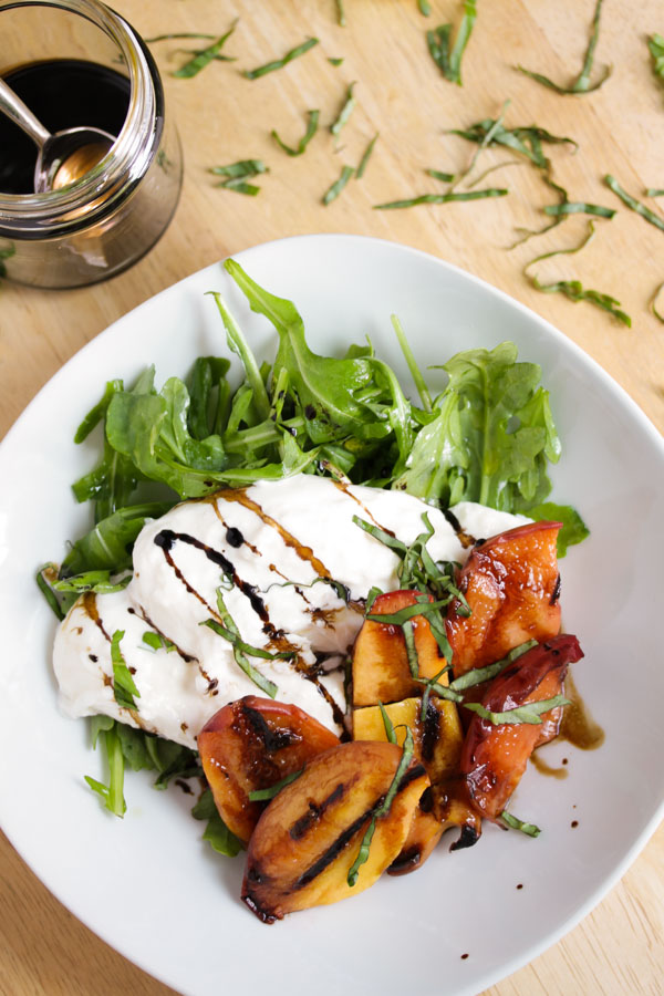 grilled peaches with burrata cheese and balsamic reduction is an excellent way to enjoy ripe summer peaches.  easy to make and tastes like summer.