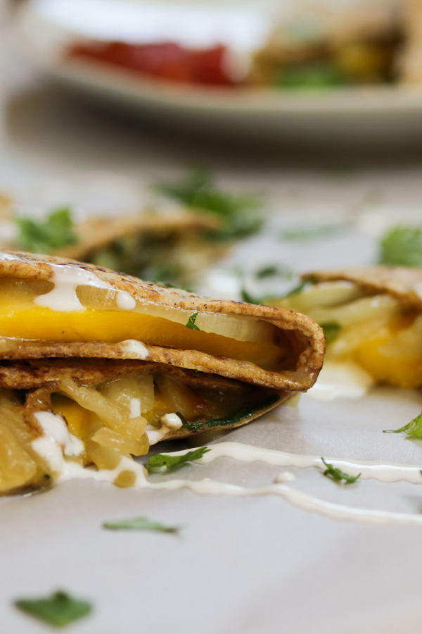 this mango brie quesadilla is quick to put together and delicious! it makes a great appetizer, snack, or light dinner. plus, mango = yum!