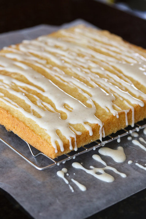this olive oil orange cake with cardamom glaze is light, fluffy, and moist, with assertive but balanced orange and cardamom flavors.