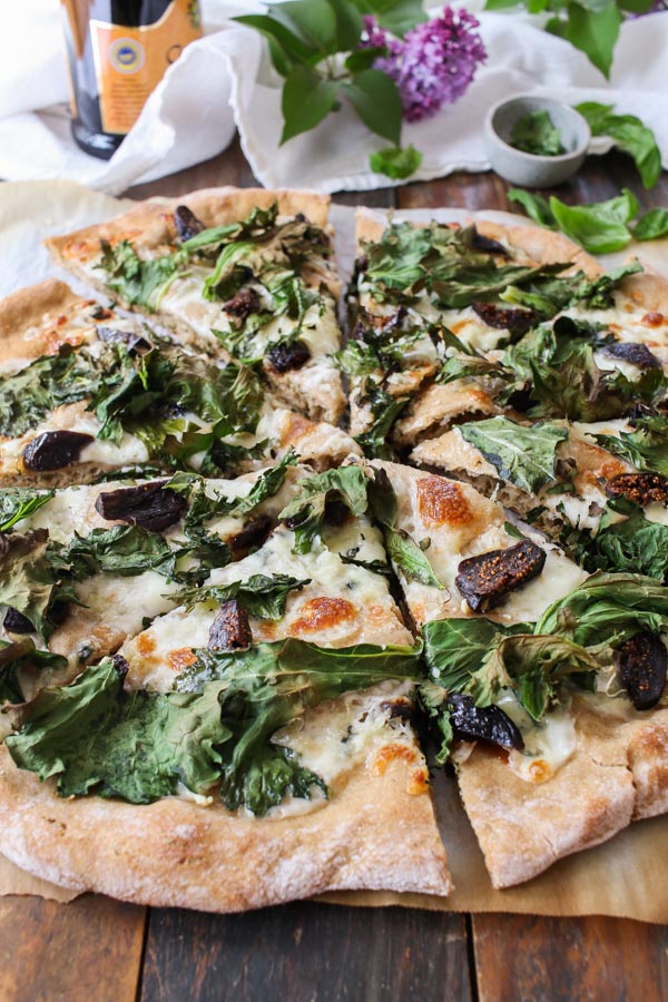 kale, fig, and gorgonzola pizza is delicious, easy to make, and healthy. sweet figs balance out the kale and gorgonzola cheese ties it together.