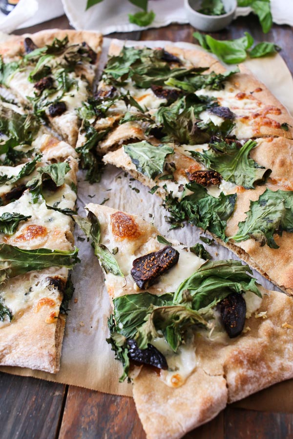 kale, fig, and gorgonzola pizza is delicious, easy to make, and healthy. sweet figs balance out the kale and gorgonzola cheese ties it together.
