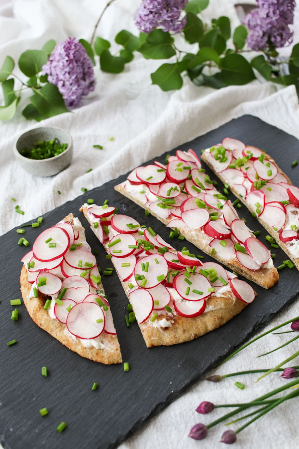 radish and whipped feta flatbread is the perfect appetizer or light dinner, combining crunchy radishes and creamy, tangy whipped feta. quick and easy.