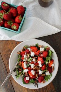 strawberry salad with maple balsamic vinaigrette combines peppery arugula with sweet strawberries and a balanced maple balsamic vinaigrette.