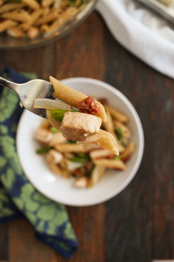 creamy pasta with chicken and garlic scapes (or asparagus) is easy and flavorful with the addition of sun dried tomatoes and onions. 