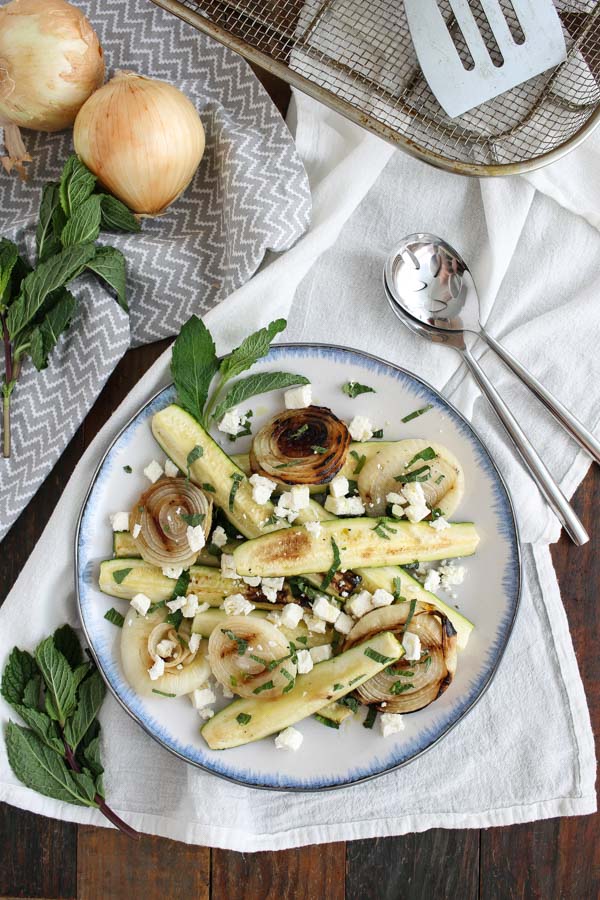 grilled zucchini and onions with mint and feta is a simple summer recipe, ready in about 10 minutes with just 5 ingredients.