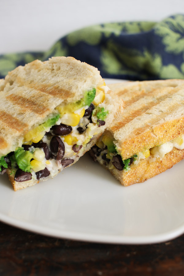 this corn, cotija, and avocado panini recipe is flexible and can either be made with chicken or black beans for a vegetarian sandwich.