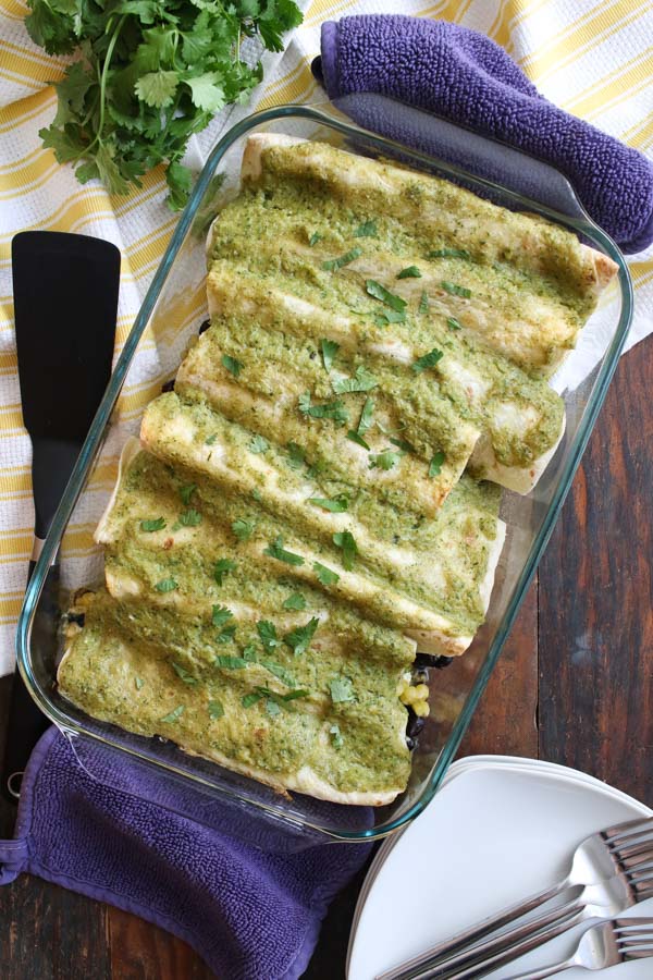 these corn and goat cheese enchiladas include sautéed mushrooms and spinach, black beans, cilantro, and cheddar for a well-rounded flavor.