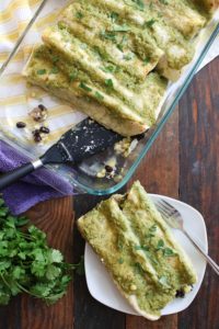 these corn and goat cheese enchiladas include sautéed mushrooms and spinach, black beans, cilantro, and cheddar for a well-rounded flavor.