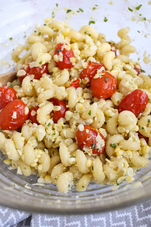this grilled corn and tomato pasta with basil tastes like summer in a bowl, is quick to put together, and won’t heat up your kitchen.
