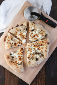 skillet pizza with mushrooms and goat cheese uses a cast iron skillet to produce an amazingly chewy and crisp crust after just 2 minutes under the broiler.