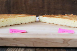 top 5 reasons why baking by weight is better than baking by volume, with photos to demonstrate the difference in a yellow cake recipe.