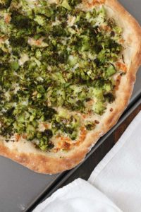 broccoli white pizza has roasted broccoli and a creamy garlic sauce that’s actually vegan – there’s an option to keep the whole pizza vegan/dairy free, if you want.