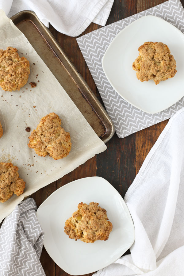 ginger crumble scones on white plates and a baking sheet