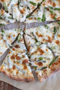 asparagus ricotta pizza is a delicious spring meal that comes together quickly from just a few simple ingredients. great vegetarian dinner!