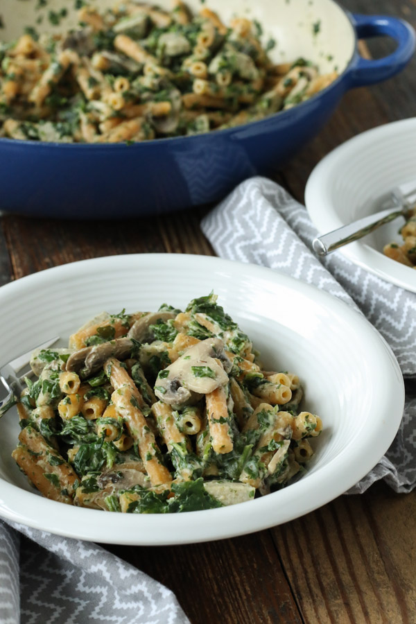 creamy mushroom and spinach pasta is quick and easy enough for a weeknight meal. gluten free, dairy free, vegetarian, and vegan options.
