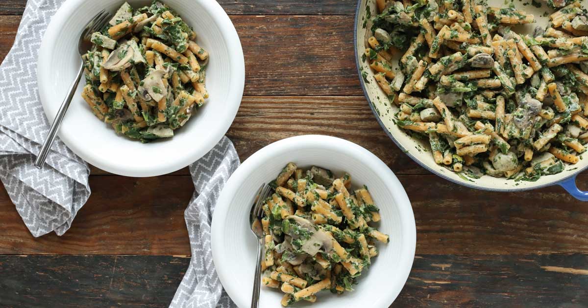 creamy mushroom and spinach pasta is quick and easy enough for a weeknight meal. gluten free, dairy free, vegetarian, and vegan options.