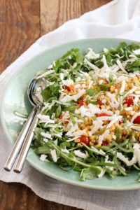 sautéed corn and tomato salad is a perfect late summer salad. sweet corn and juicy tomatoes pair deliciously with spicy arugula and salty ricotta salata.