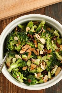 broccoli salad with dried cranberries and almonds is perfect for fall, as it’s crunchy and bright and includes dried cranberries and toasted nuts.