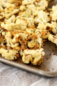 cumin roasted cauliflower is a simple and flavor-packed vegetable side dish that goes well with chicken, lentils, black beans – anything you want!