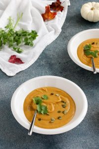 red lentil pumpkin soup gets a spicy kick from fresh ginger and cooks quickly so you can enjoy it on a weeknight. vegan and gluten free.