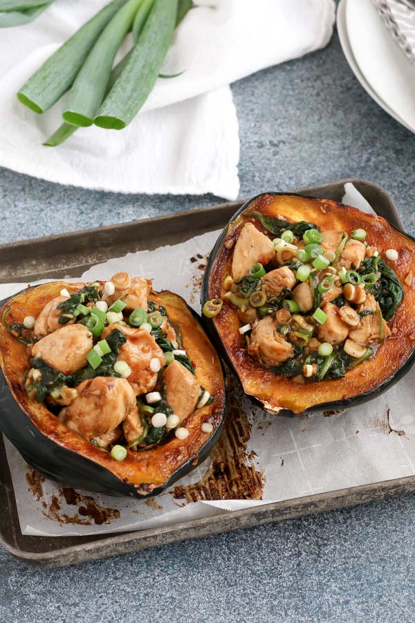 hoisin chicken stuffed acorn squash is packed with flavor from an enhanced hoisin sauce. chicken and spinach make it a meal in a bowl.