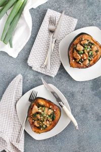 hoisin chicken stuffed acorn squash is packed with flavor from an enhanced hoisin sauce. chicken and spinach make it a meal in a bowl.