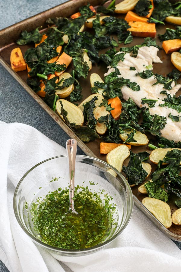 roasted chicken and potatoes with chimichurri is an easy recipe that’s packed with flavor. everything cooks on sheet pans for fast cleanup.