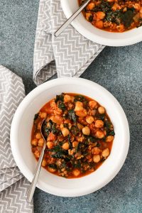 spanish chorizo and rice soup is hearty and flavorful, with chorizo, chick peas, kale, and rice. gluten and dairy free. perfect for cold nights.