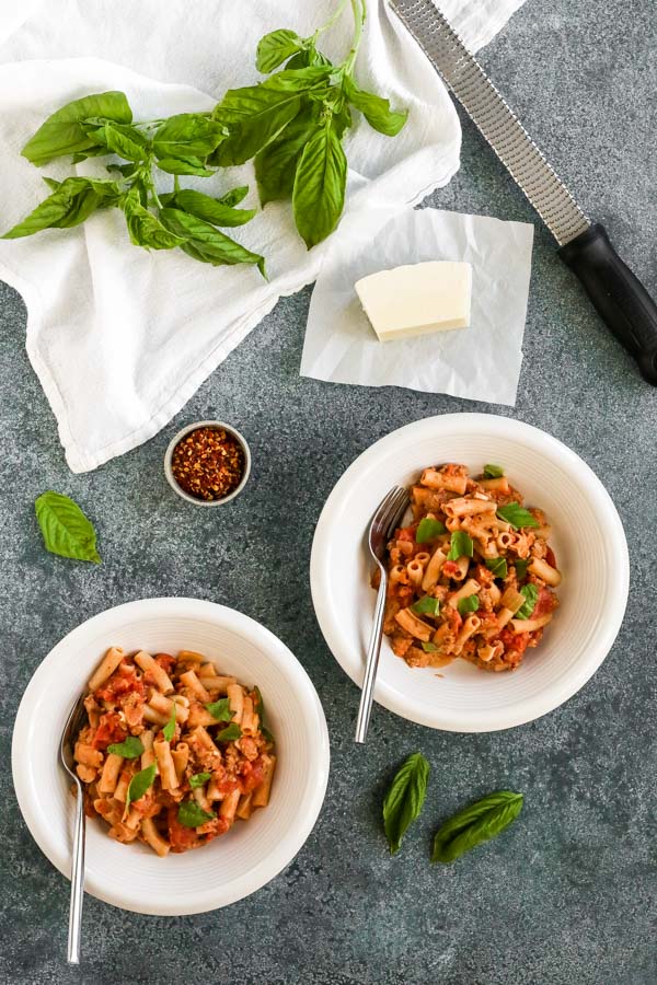 creamy tomato pasta with sausage is hearty and filling without being heavy – and there’s even a dairy free option! delicious and easy to make.