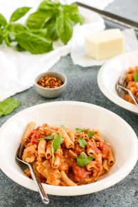 creamy tomato pasta with sausage is hearty and filling without being heavy – and there’s even a dairy free option! delicious and easy to make.