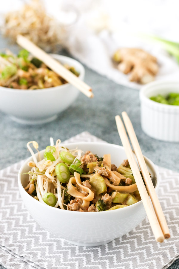 dan dan noodles are a savory one bowl dinner with pork, broccoli, and a flavorful peanut based sauce. perfect for meal prepping, gluten free, dairy free.