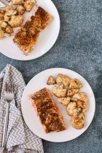 sheet pan salmon and cauliflower with spice rub is an easy weeknight dinner that comes together in 35 minutes with just 7 ingredients. mustard and just 3 pantry spices provide tons of flavor in this healthy recipe. get the recipe now for dinner tonight!