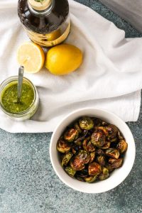 simple roasted brussels sprouts turn 4 simple ingredients into an amazing side dish that goes with everything. the sprouts turn tender on the inside and crispy on the outside. brussels sprouts, olive oil, and lemon are all you need - get this easy recipe now!