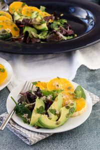 citrus avocado salad with jalapeño vinaigrette combines oranges and avocado in a refreshing winter salad. roasted jalapeño brightens up the vinaigrette and pepitas add crunch for contrast. get the recipe for this company-worthy salad today!