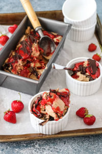 homemade hazelnut ice cream with strawberry and chocolate swirls in white ramekins.