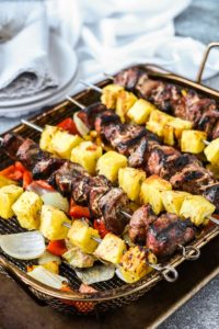 grilled chopped pork, pineapple, and peppers on skewers